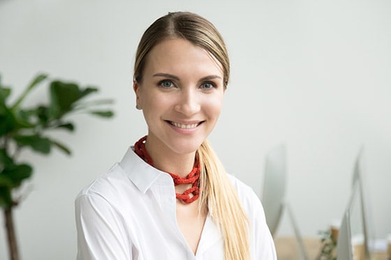 Smiling young woman. Each Take Note instructor or tutor is highly trained and has undergone a full background check.